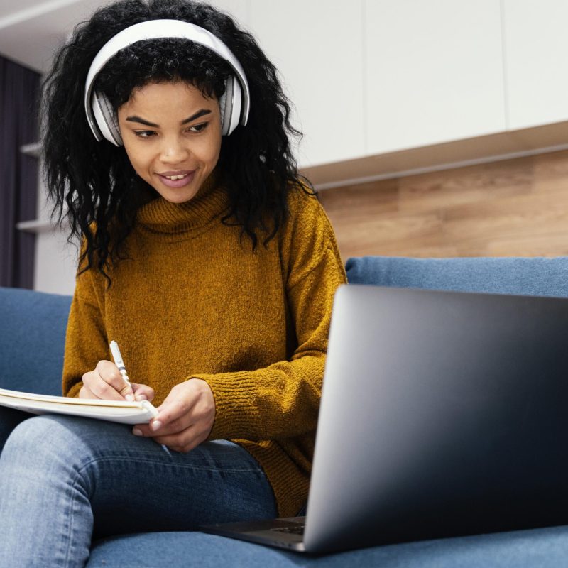 happy-teenage-girl-with-headphones-online-school