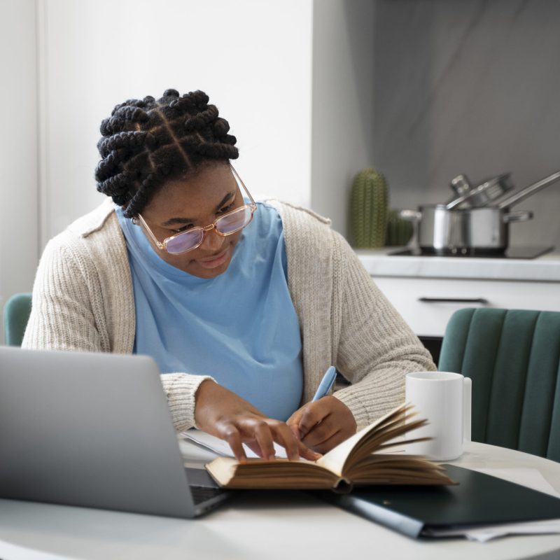 medium-shot-woman-with-laptop-home